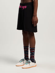 Sprayed Logo Sweatshorts in BLACK - FUCHSIA for Men