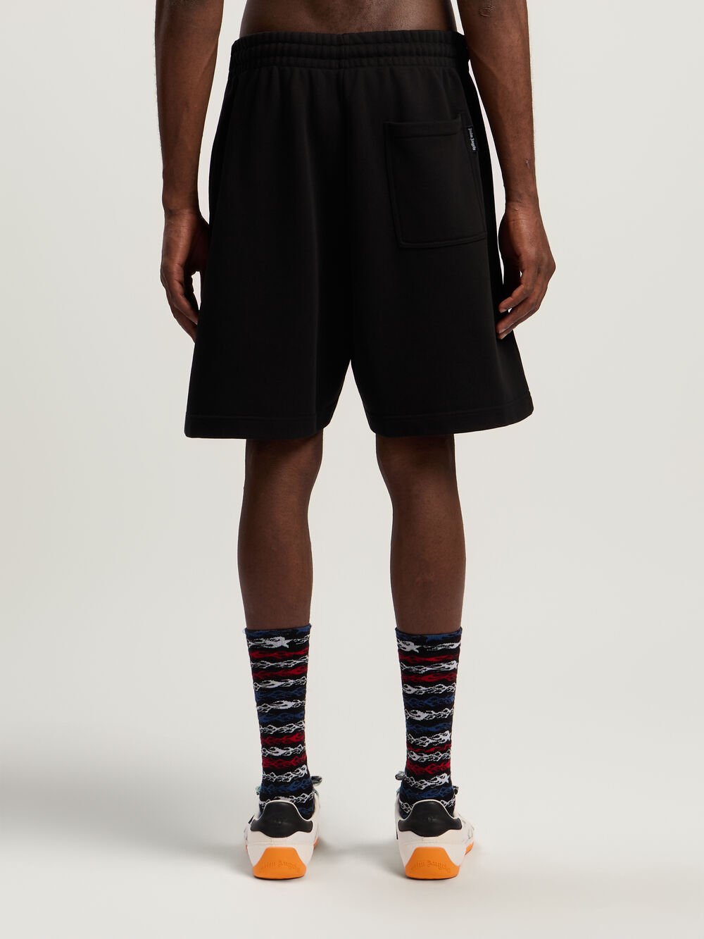 Sprayed Logo Sweatshorts in BLACK - FUCHSIA for Men